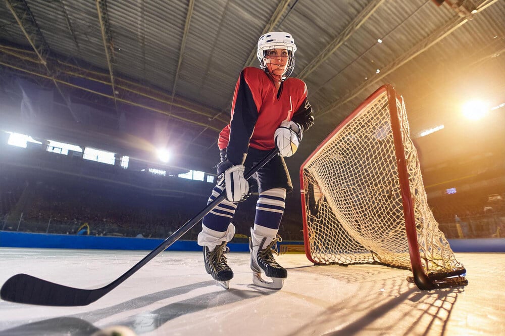 women playing hockey